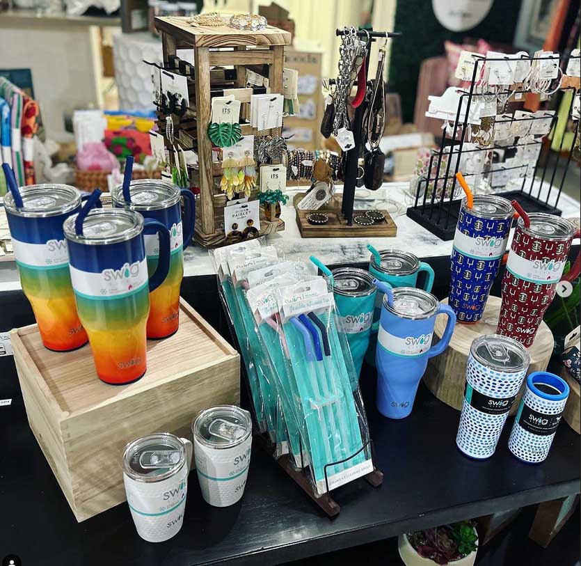 colorful metal cups and silicone straws displayed on a table